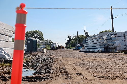 A look down Buckingham Street. The Municipality of Boissevain-Morton gave approval to sell the portion of Buckingham Street to Western Archrib in a vote on Sept. 1, however the bylaw will need to be reviewed by the Manitoba government before it is approved. The portion of Buckingham Street is planned to be sold to facilitate Western Archrib’s growth within Boissevain. The portion of Buckingham Street in front of Western Archrib has been informally closed for more than a year, using a row of pylons and rope, while the manufacturer uses the road as part of its operations. A team is seen using a forklift to load a flat bed around stock stored along the road and a portable bathroom in this photo. (Connor McDowell/The Brandon Sun)