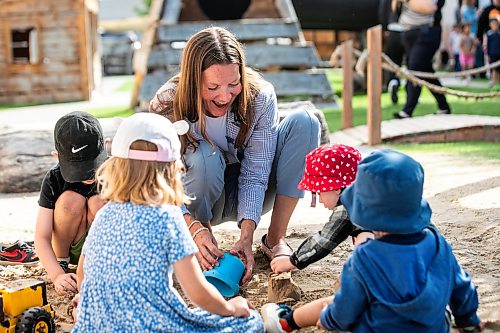 MIKAELA MACKENZIE / FREE PRESS
Minister Tracy Schmidt plays in the sandbox with children after making a child care announcement at Panda Bear Day Care on Wednesday, Sept. 2, 2026.
For Nicole story.
Free Press 2026