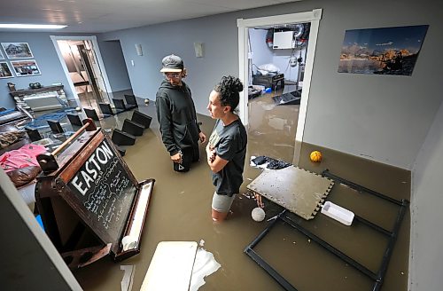 Ruth Bonneville Free Press
Local Balmoral Flooding, Killbery family
J’aime Killbery, her son Easton Killbery, and her partner Blair Mollberg work to salvage treasured family memorabilia as they wade through a basement flooded with a mixture of sewage and rainwater following Wednesday’s torrential storm. Many of the items belonged to Easton’s late father, who passed away three years ago, including family photographs and keepsakes that had been stored in Easton’s basement room.
Tornado warnings, hail, and a record 250 mm of rainfall struck the Stonewall, Balmoral and surrounding areas, causing widespread flooding and significant damage to homes and property.
June 10th,, 2026