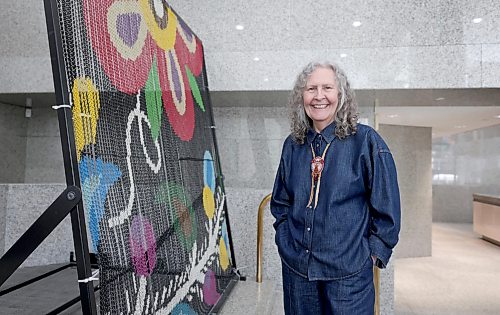 Ruth Bonneville / Free Press
ENT - Metis / Main
Portrait of Metis beadwork artist, Jennine Karachi, next to a small sample of the chain link artististy that has been draped on the outside of the MMF's Bank of Montreal building at Portage and Main. Karachi designed the artwork for the large installation that will hang on the building.
What: Profile of the MMF's Bank of Montreal transformation
Reporter: Conrad Sweatman
Sept 2nd, 2026