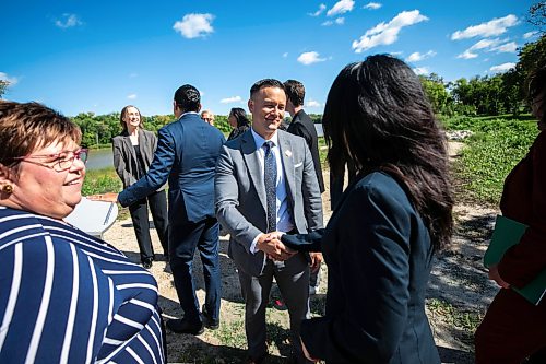MIKAELA MACKENZIE / FREE PRESS
	
Environment minister Mike Moyes shakes hands after a press conference for a net zero action plan announcement at Southwood Circle on Wednesday, Sept. 9, 2026.

For Carol story.
Free Press 2026