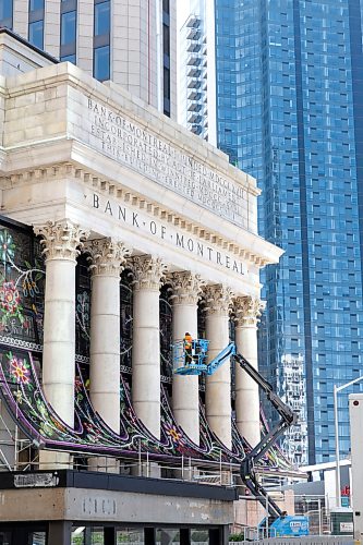 Ruth Bonneville / Free Press
ENT - Metis / Main
Photo of the massive metal chain screen featuring a traditional floral Métis beadwork design is being installed on the facade of Winnipeg's historic Bank of Montreal building at Portage and Main.
The Artist: Created by renowned Red River Métis artist Jennine Krauchi.
Reporter: Conrad Sweatman
Sept 9th, 2026