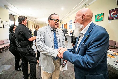 MIKAELA MACKENZIE / FREE PRESS
	
SCO grand chief Jerry Daniels (left) shakes hands with Terry Neplyk at a Manitoba mineral and supply chain exchange at the Manitoba Legislative Building on Thursday, Sept. 10, 2026.

For Gabby story.
Free Press 2026