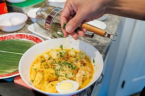 MIKE DEAL / FREE PRESS
Malvin Soh prepairs Nonya Laksa in his kitchen.
Malvin Soh is busy prepping for his pop-up restaurant Sedap Singapore Kitchen. Soh is excited to introduce Winnipeggers to the spicy, complex and delicious flavours of the small island nation.
Reporter: AV Kitching
260910 - Thursday, September 10, 2026.