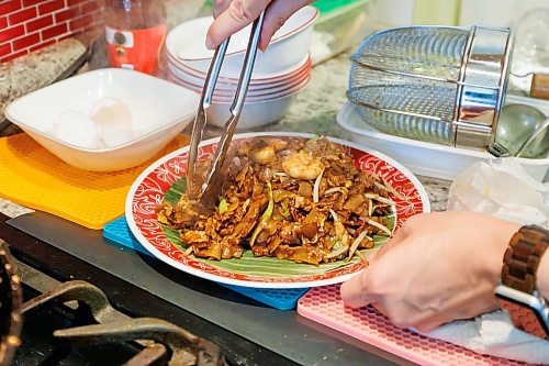 MIKE DEAL / FREE PRESS
Malvin Soh prepairs Char Kway Teow in his kitchen.
Malvin Soh is busy prepping for his pop-up restaurant Sedap Singapore Kitchen. Soh is excited to introduce Winnipeggers to the spicy, complex and delicious flavours of the small island nation.
Reporter: AV Kitching
260910 - Thursday, September 10, 2026.