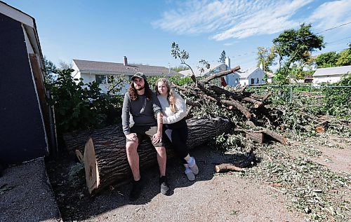 Ruth Bonneville / Free Press
LOCAL - River Heights tornado
Photo of Lindsay street resident Tanner Lemieux with his wife Cassidy Lemieux, in the back yard where huge trees were thrown around during Sunday’s storm.
Story: It was confirmed today that a tornado touched down during a wild storm in River Heights Sunday night. Tanner Lemieux, whose door camera footage helped the northern tornadoes project nail down the time of the storm. He made it into his house minutes before his neighbour's car flipped due to the heavy winds.
See story by Malak
Sept 10th, 2026