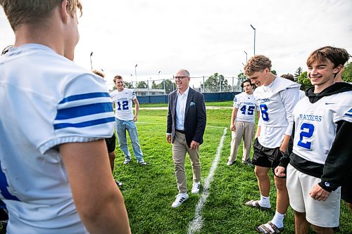 MIKAELA MACKENZIE / FREE PRESS
	
Scott Gillingham shakes hands with Oak Park Raiders varsity football players before making a campaign announcement promising to invest in turf fields on Friday, Sept. 11, 2026.

For Malak story.
Free Press 2026