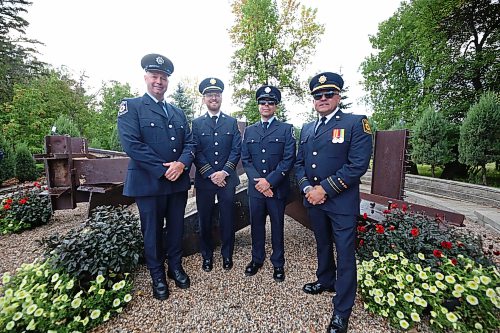 Firefighters from CFB Shilo pose for a group picture in front of the 9/11 Memorial at the International Peace Garden on Friday morning, shortly before a ceremony marking the 25th anniversary of the terrorist attack. (Matt Goerzen/The Brandon Sun)