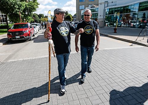 JOHN WOODS / FREE PRESS
Joseph Foure and Sonny HAmilton walk in the Fentanyl Awareness Day Walk from the Forks to the legislature Sunday, September 13, 2026.
reporter: marsha