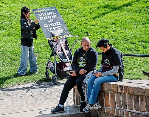 JOHN WOODS / FREE PRESS
A person places a sign as people participate in the Fentanyl Awareness Day Walk from the Forks to the legislature Sunday, September 13, 2026.
reporter: marsha