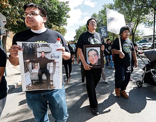 JOHN WOODS / FREE PRESS
Dr Stewart Hill holds a photo of his son as he and other people participate in the Fentanyl Awareness Day Walk from the Forks to the legislature Sunday, September 13, 2026.
reporter: marsha