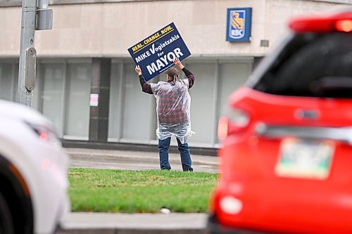 Mike Sudoma/Free Press
A supporter holds up a sign promoting Mayoral Candidate Mike Vogiatzakis outside of Union Centre prior to the Transit Debate Monday evening
September 14, 2026