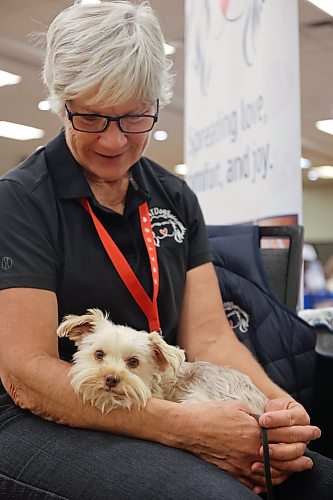 Ngaire Abernethy, PAT Dogs co-ordinator, with her dog Koki at the 2026 Health Checks event. (Rylee Gerrard/The Brandon Sun)