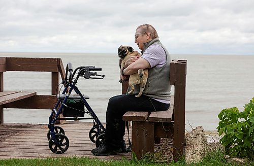 Ruth Bonneville / Free Press
49.8 Seniors and pets
Leota Ward, enjoys a fall morning sitting with her dog Clover a pug, next to her on a bench overlooking Lake Winnipeg near her cottage Tuesday.
Story: 49 8, extended feature, Seniors and companion animals, the benefits and the challenges related to finding affordable pet friendly housing. Pets can enhance well-being, and quality of life for seniors. It is considerably more challenging to find accommodation that will welcome
Story publication date: upcoming Saturday in September.
Sept 15th, 2026