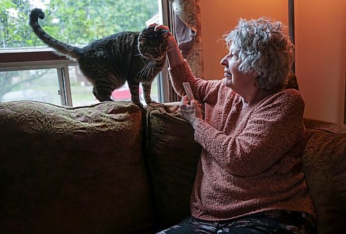 Ruth Bonneville / Free Press
49.8 Seniors and pets
Shannon McGuniga cuddles with her cat Rhythm, one of her four, on her couch next to the window they spend a lot of time at Monday.
Story publication date: upcoming Saturday in September.
Story: 49 8, extended feature, Seniors and companion animals, the benefits and the challenges related to finding affordable pet friendly housing. Pets can enhance well-being, and quality of life for seniors. It is considerably more challenging to find accommodation that will welcome
Story publication date: upcoming Saturday in September.
Sept 15th, 2026
