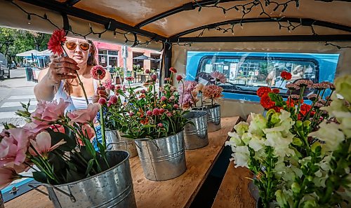 JOHN WOODS / FREE PRESS
Magwyer Herring, who sells her flowers from a 1958 Chevy Apache at markets, was out selling her goods on Corydon Sunday, September 6, 2026.

reporter: dave