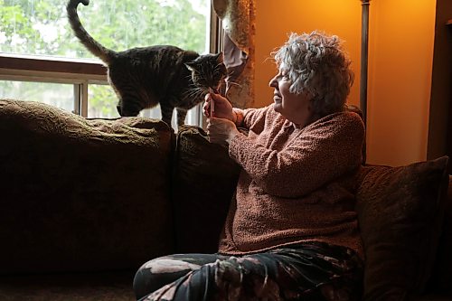Ruth Bonneville / Free Press

49.8 Seniors and pets 

Shannon McGuniga cuddles with her cat Rhythm, one of her four,  on her couch next to the window they spend a lot of time at Monday. 

Story publication date:  upcoming Saturday in September.
 
Story: 49 8, extended feature, Seniors and companion animals, the benefits and the challenges related to finding affordable pet friendly housing. Pets can enhance well-being, and quality of life for seniors.  It is considerably more challenging to find accommodation that will welcome
 
Story publication date:  upcoming Saturday in September.


Sept 15th,   2026
