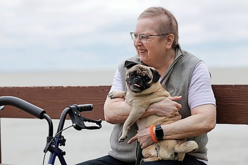 Ruth Bonneville / Free Press
49.8 Seniors and pets
Leota Ward, enjoys a fall morning sitting with her dog Clover a pug, next to her on a bench overlooking Lake Winnipeg near her cottage Tuesday.
Story: 49 8, extended feature, Seniors and companion animals, the benefits and the challenges related to finding affordable pet friendly housing. Pets can enhance well-being, and quality of life for seniors. It is considerably more challenging to find accommodation that will welcome
Story publication date: upcoming Saturday in September.
Sept 15th, 2026