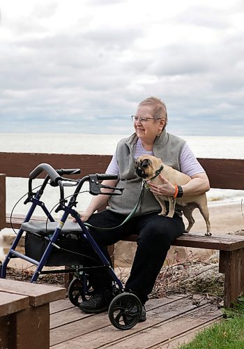 Ruth Bonneville / Free Press
49.8 Seniors and pets
Leota Ward, enjoys a fall morning sitting with her dog Clover a pug, next to her on a bench overlooking Lake Winnipeg near her cottage Tuesday.
Story: 49 8, extended feature, Seniors and companion animals, the benefits and the challenges related to finding affordable pet friendly housing. Pets can enhance well-being, and quality of life for seniors. It is considerably more challenging to find accommodation that will welcome
Story publication date: upcoming Saturday in September.
Sept 15th, 2026