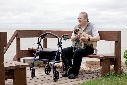 Ruth Bonneville / Free Press
49.8 Seniors and pets
Leota Ward, enjoys a fall morning sitting with her dog Clover a pug, next to her on a bench overlooking Lake Winnipeg near her cottage Tuesday.
Story: 49 8, extended feature, Seniors and companion animals, the benefits and the challenges related to finding affordable pet friendly housing. Pets can enhance well-being, and quality of life for seniors. It is considerably more challenging to find accommodation that will welcome
Story publication date: upcoming Saturday in September.
Sept 15th, 2026
