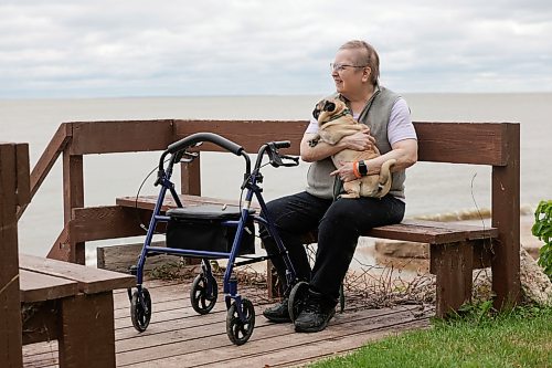 Ruth Bonneville / Free Press
49.8 Seniors and pets
Leota Ward, enjoys a fall morning sitting with her dog Clover a pug, next to her on a bench overlooking Lake Winnipeg near her cottage Tuesday.
Story: 49 8, extended feature, Seniors and companion animals, the benefits and the challenges related to finding affordable pet friendly housing. Pets can enhance well-being, and quality of life for seniors. It is considerably more challenging to find accommodation that will welcome
Story publication date: upcoming Saturday in September.
Sept 15th, 2026