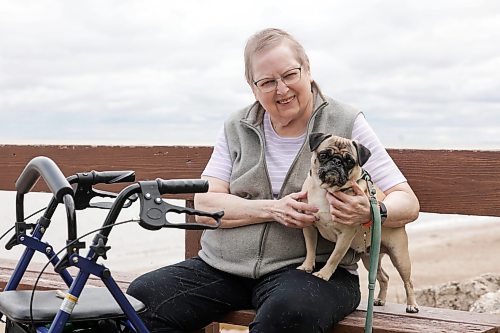 Ruth Bonneville / Free Press
49.8 Seniors and pets
Leota Ward, enjoys a fall morning sitting with her dog Clover a pug, next to her on a bench overlooking Lake Winnipeg near her cottage Tuesday.
Story: 49 8, extended feature, Seniors and companion animals, the benefits and the challenges related to finding affordable pet friendly housing. Pets can enhance well-being, and quality of life for seniors. It is considerably more challenging to find accommodation that will welcome
Story publication date: upcoming Saturday in September.
Sept 15th, 2026