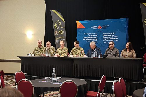 A panel was held at the front of the room. (Connor McDowell/The Brandon Sun)