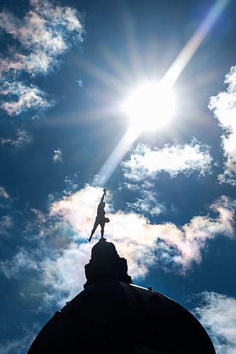 Ruth Bonneville / Free Press
Local Permanent Daylight Saving Time
Photo of the Golden Boy silhouetted against the sky as the afterboon rays of sunshine brilliantly light the skies Thursday.
The Golden Boy is a 5.25-metre gilded statue atop the Manitoba Legislative Building that faces north toward the province's natural resources, holding a sheaf of wheat to symbolize its rich agricultural heritage.
Photo for story on keeping daylight savings time.
Manitoba Will Move to Permanent Daylight Saving Time
After listening to the views of Manitobans on seasonal time changes, the Manitoba government has decided to remain on daylight saving time (DST) permanently, Premier Wab Kinew announced today.
Sept 17th, 2026