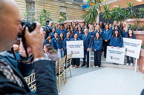 MIKE DEAL / FREE PRESS
Dental Hygiene students gather around Dr. Ernest Cholakis as he is celebrated during a special event Thursday morning, in the UofM’s Brodie Centre Atrium for his philanthropic gift of $2 million in support of dental care in Manitoba.
The UofM has subsequently renamed its dental hygiene program the Cholakis School of Dental Hygiene.
Reporter: Melissa Martin
260917 - Thursday, September 17, 2026.