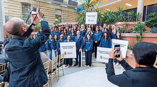 MIKE DEAL / FREE PRESS
Dental Hygiene students gather around Dr. Ernest Cholakis as he is celebrated during a special event Thursday morning, in the UofM’s Brodie Centre Atrium for his philanthropic gift of $2 million in support of dental care in Manitoba.
The UofM has subsequently renamed its dental hygiene program the Cholakis School of Dental Hygiene.
Reporter: Melissa Martin
260917 - Thursday, September 17, 2026.