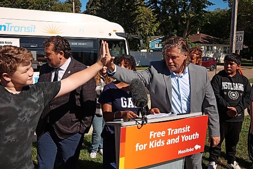 17092026
Brandon Mayor Jeff Fawcett high-fives students from George Fitton School after an announcement by Northern Relations Minister Glen Simard about free public transit for youth in Brandon on Thursday. (Tim Smith/The Brandon Sun)