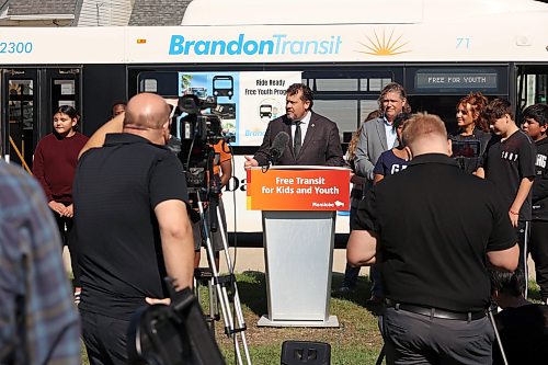 17092026
Flanked by students from George Fitton School, Brandon Mayor Jeff Fawcett and Shannon Vogel, vice-principal for George Fitton, Municipal and Northern Relations Minister Glen Simard speaks during an announcement about free public transit for youth in Brandon on Thursday. (Tim Smith/The Brandon Sun)