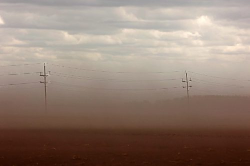 Top soil from a field bordering Highway 250 southwest of Rivers is carried across the prairie during intense winds in May. Dust storms affecting farms were one of several stressors, including tariffs, fuel costs and rainy harvest weather this year (Tim Smith/The Brandon Sun files)
