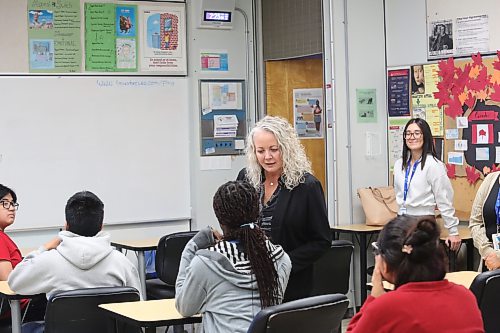 Brandon School Division assistant superintendent of student services Susan Gilleshammer (centre) talks to Vincent Massey High School students during an after-school tutoring and mentoring program on Friday afternoon. (Abiola Odutola/The Brandon Sun)