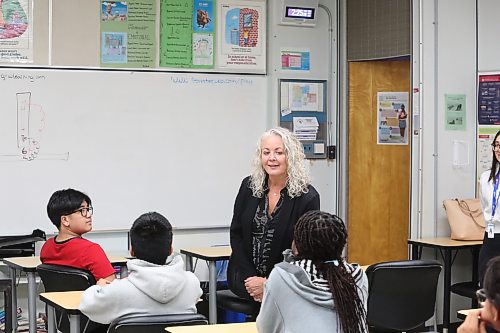Brandon School Division assistant superintendent of student services Susan Gilleshammer (centre) talks to Vincent Massey High School students during an after-school tutoring and mentoring program on Friday afternoon. (Abiola Odutola/The Brandon Sun) 
