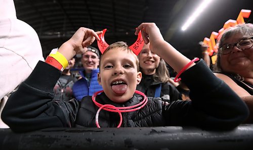 Jason Halstead / Free Press
Silas Pylypiw, 9, gets ready for AC/DC to take the stage with his parents Mavis and Jonathan at Princess Auto Stadium in Winnipeg on Sept. 20, 2026.