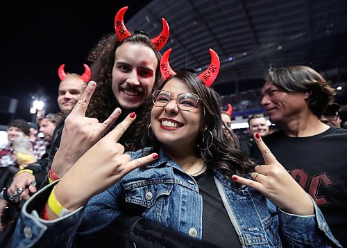 Jason Halstead / Free Press
Front-row fans (from left) Andre Bornmann and Luma Lopes get ready for AC/DC to take the stage at Princess Auto Stadium on Sept. 20, 2026.