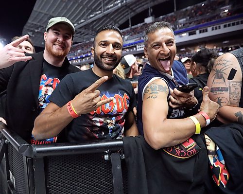 Jason Halstead / Free Press
Father-and-son duo Mark Nagra (right) and Matthew Nagra, both of Vancouver, prepare to take in (respectively) their 86th and 46th AC/DC live shows at Princess Auto Stadium on Sept. 20, 2026.