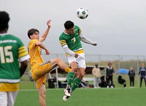 Kevin Cruz heads a ball for the Assiniboine College Cougars against the Brandon University Bobcats. (Thomas Friesen/The Brandon Sun)