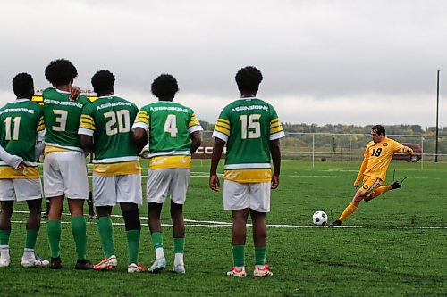Brandon University Bobcats Matheus Ruffini takes a free kick against the Assiniboine College Cougars. (Thomas Friesen/The Brandon Sun)