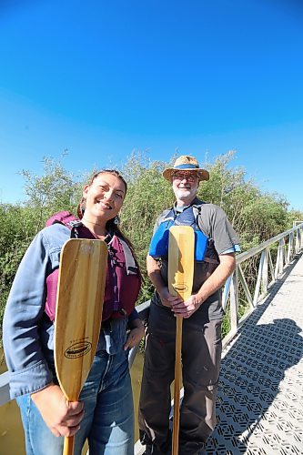 Ingrid Gatin and Dean Hammond on the boat launch with paddle equipment ahead of the 2026 Paddlefest scheduled for Saturday, Sept. 26. (Rylee Gerrard/The Brandon Sun)