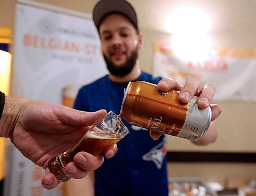 Logan Henry pours a sample of Original 16 Canadian Copper Ale at the Brandon Beer Tasting Festival Saturday night at the Victoria Inn. (Ian Froese/The Brandon Sun)