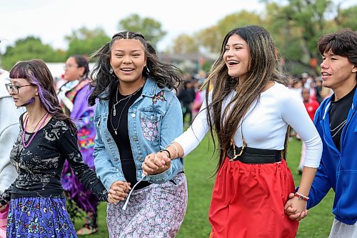 Ruth Bonneville / Free Press
Standup WSD Pow Wow
Group of grade 11 and 12 students from St. John’s High School take part in the intertribal dance as they hold hands while moving in a large circle formation during WSD event Thursday
Names from L - R. Alexis Ironwing (purple), Aliya Yellowback (jean), Paityn Wilson (jred skirt) and Leland Clarke.
Students, staff, and community members gather at the Naawi-Oodena Field on the former Kapyong Barracks lands for the Winnipeg School Division's Dagwaagin Pow Wow on Thursday.
Held in partnership with Treaty One Nations at Kenaston Boulevard and Grant Avenue, the division-wide event featured a Grand Entry, traditional dancing, and cultural learning sessions honoring Indigenous traditions.
Sept 24th, 2026