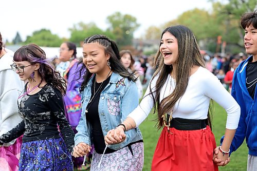 Ruth Bonneville / Free Press
Standup WSD Pow Wow
Group of grade 11 and 12 students from St. John’s High School take part in the intertribal dance as they hold hands while moving in a large circle formation during WSD event Thursday
Names from L - R. Alexis Ironwing (purple), Aliya Yellowback (jean), Paityn Wilson (jred skirt) and Leland Clarke.
Students, staff, and community members gather at the Naawi-Oodena Field on the former Kapyong Barracks lands for the Winnipeg School Division's Dagwaagin Pow Wow on Thursday.
Held in partnership with Treaty One Nations at Kenaston Boulevard and Grant Avenue, the division-wide event featured a Grand Entry, traditional dancing, and cultural learning sessions honoring Indigenous traditions.
Sept 24th, 2026