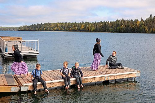 24092026
Students from Riverdale Hutterite Colony near Gladstone explore the docks along the pier on Clear Lake at Wasagaming during a field trip on a warm Thursday afternoon. 
(Tim Smith/The Brandon Sun)