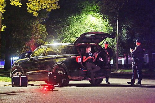 A drone operated by Brandon Police waits to take off from the ground on Whillier Drive in front several officers during an armed standoff late Thursday evening. Brandon police operated at least two drones over the course of the evening as they staked out a residence one street down on Creighton Boulevard. (Matt Goerzen/The Brandon Sun)