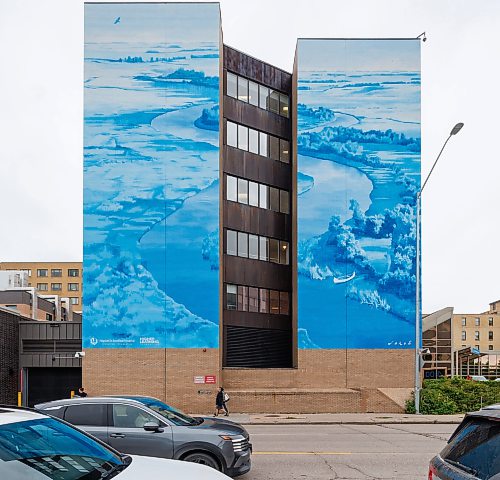 MIKE DEAL / FREE PRESS
Pedestrians walk along Taché past the brand new mural on the side of the St. Boniface Hospital Friday afternoon.
St. Boniface Hospital, St. Boniface Hospital Foundation, and the Higher Learning Foundation have unveiled a new large-scale mural on the front of St. Boniface Hospital today, bringing vibrant public art to Taché Avenue and celebrating the Hospital’s history, community, and commitment to fostering healing through the arts.
Created by Canadian-born artist and muralist Emmanuel Jarus, the mural draws inspiration from the natural landscape of the Red River Valley and the heritage of the Grey Nuns, who arrived in the community by canoe more than 150 years ago and founded St. Boniface Hospital, establishing a tradition of compassionate care that continues today.
Standup
260925 - Friday, September 25, 2026.