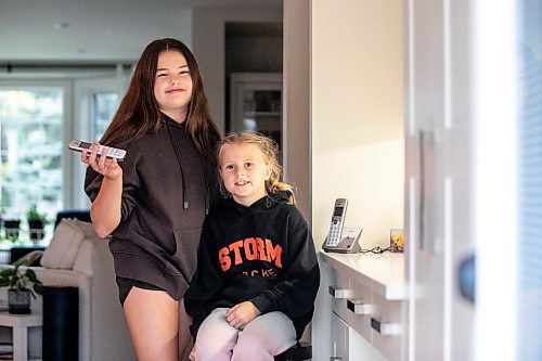 MIKAELA MACKENZIE / FREE PRESS
Emily (13, left) and Julie (eight) Sobkowicz with their family landline phone on Friday, Sept. 25, 2026.
For Sheldon story.
Free Press 2026