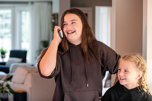 MIKAELA MACKENZIE / FREE PRESS
Emily (13, left) and Julie (eight) Sobkowicz with their family landline phone on Friday, Sept. 25, 2026.
For Sheldon story.
Free Press 2026