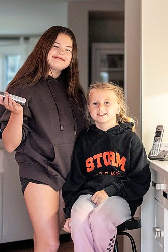 MIKAELA MACKENZIE / FREE PRESS
Emily (13, left) and Julie (eight) Sobkowicz with their family landline phone on Friday, Sept. 25, 2026.
For Sheldon story.
Free Press 2026